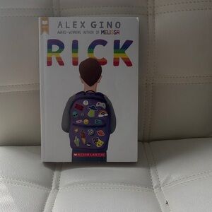 Scholastic Hardcover Book with Rainbow and Blue Design